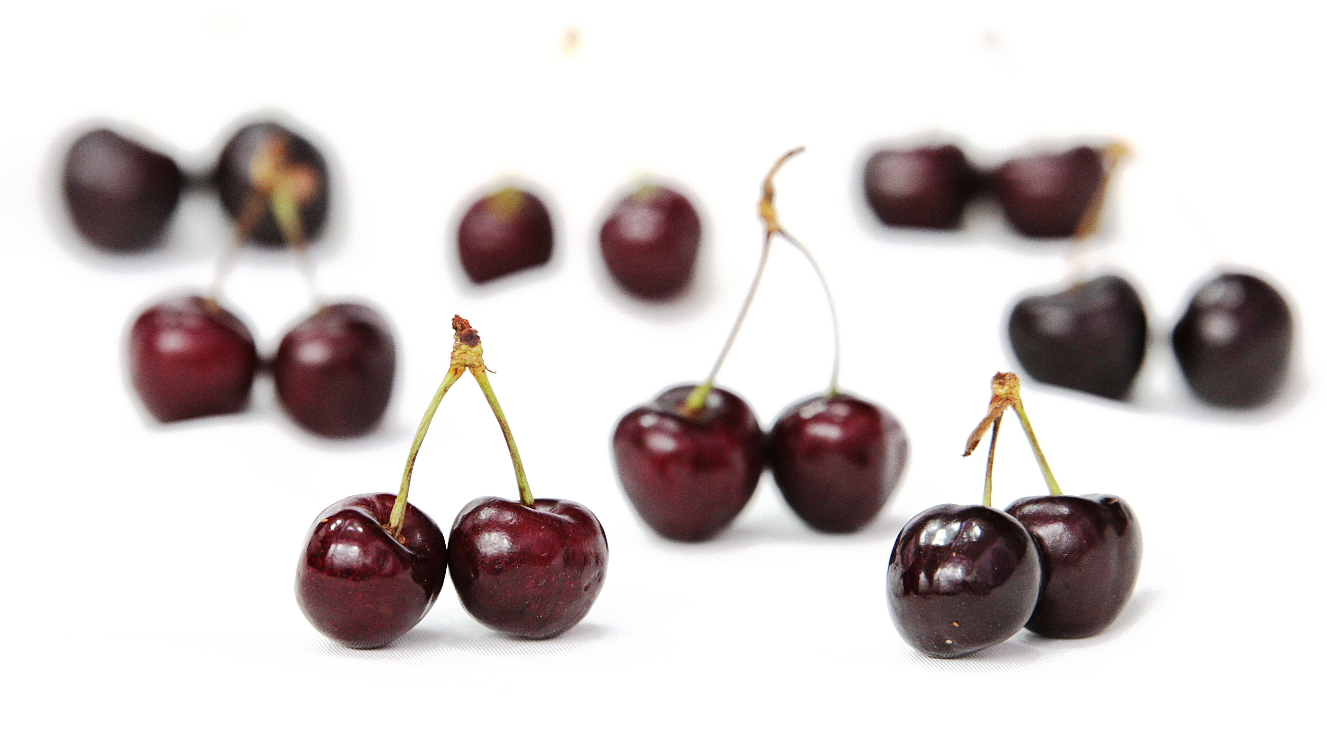 Cherries on a white surface