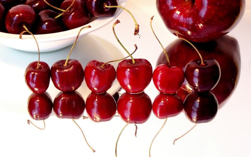 Cherries on Reflective Surface