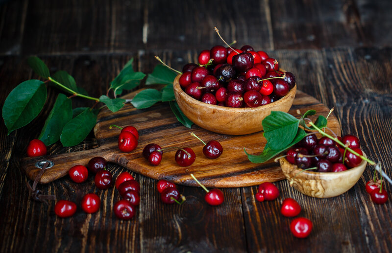Cherries on Wooden Board