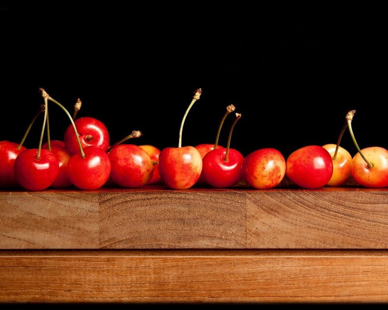 Cherries on wooden surface