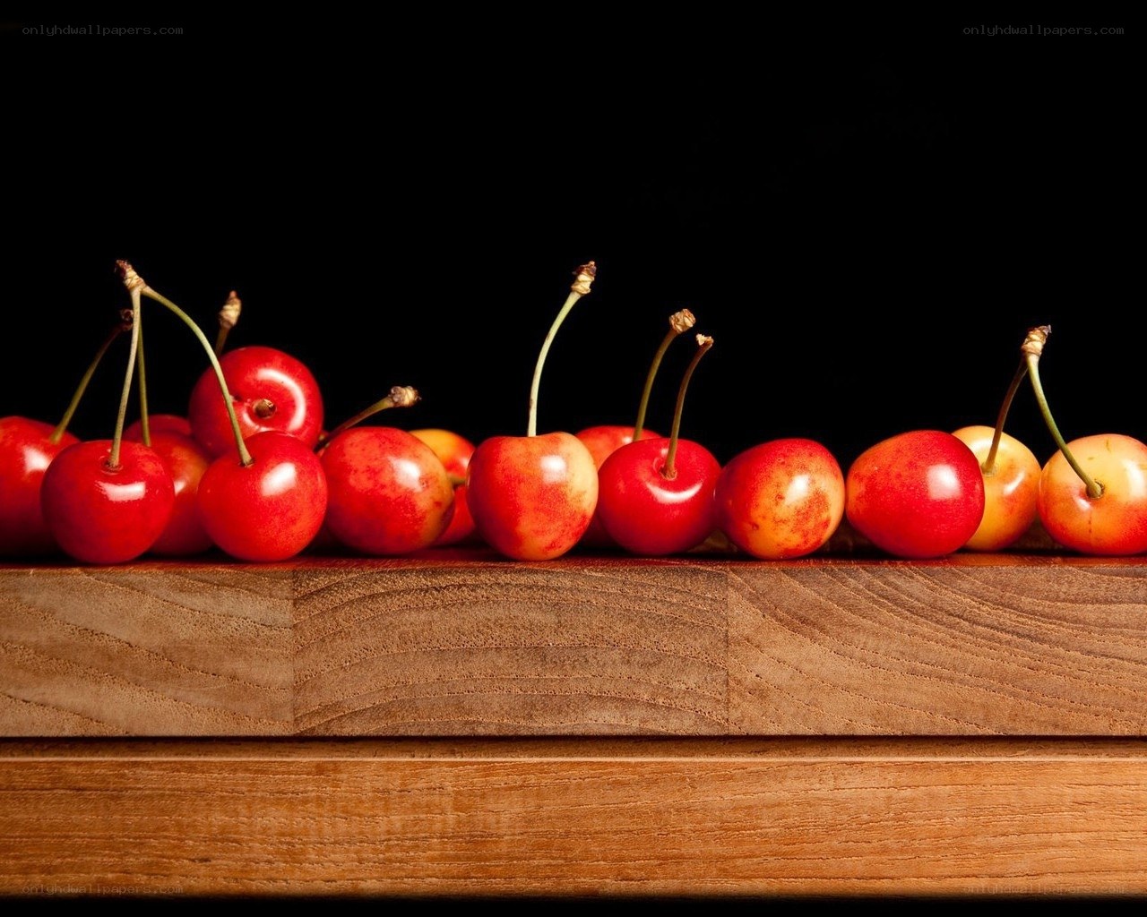 Cherries on wooden surface