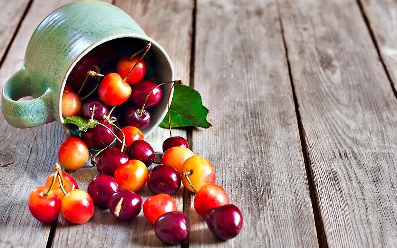 Cherries Spilling from Cup