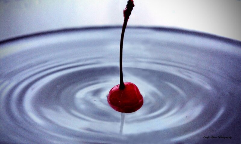 cherry dropping into water