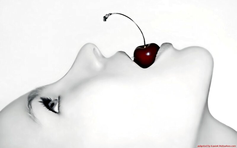 Cherry on a woman's lips