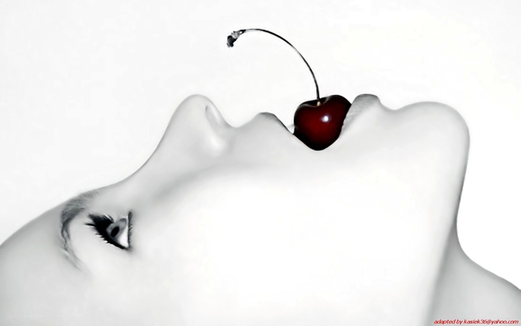 Cherry on a woman's lips