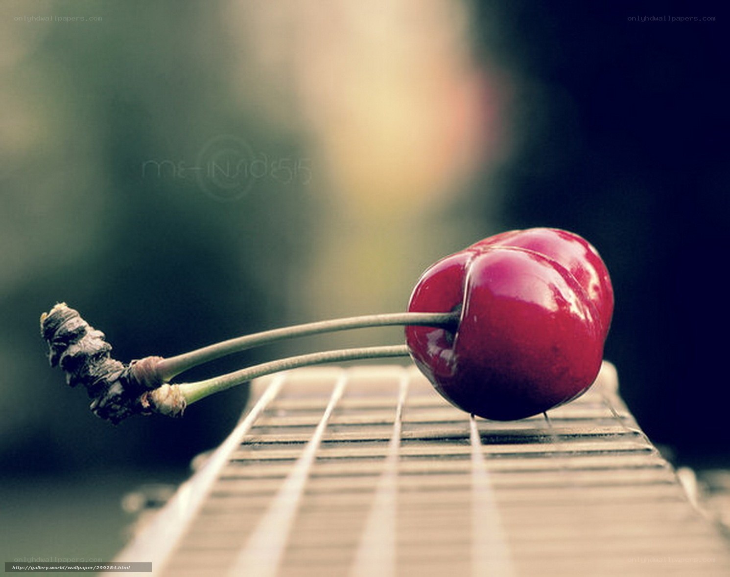 Cherry on guitar fretboard
