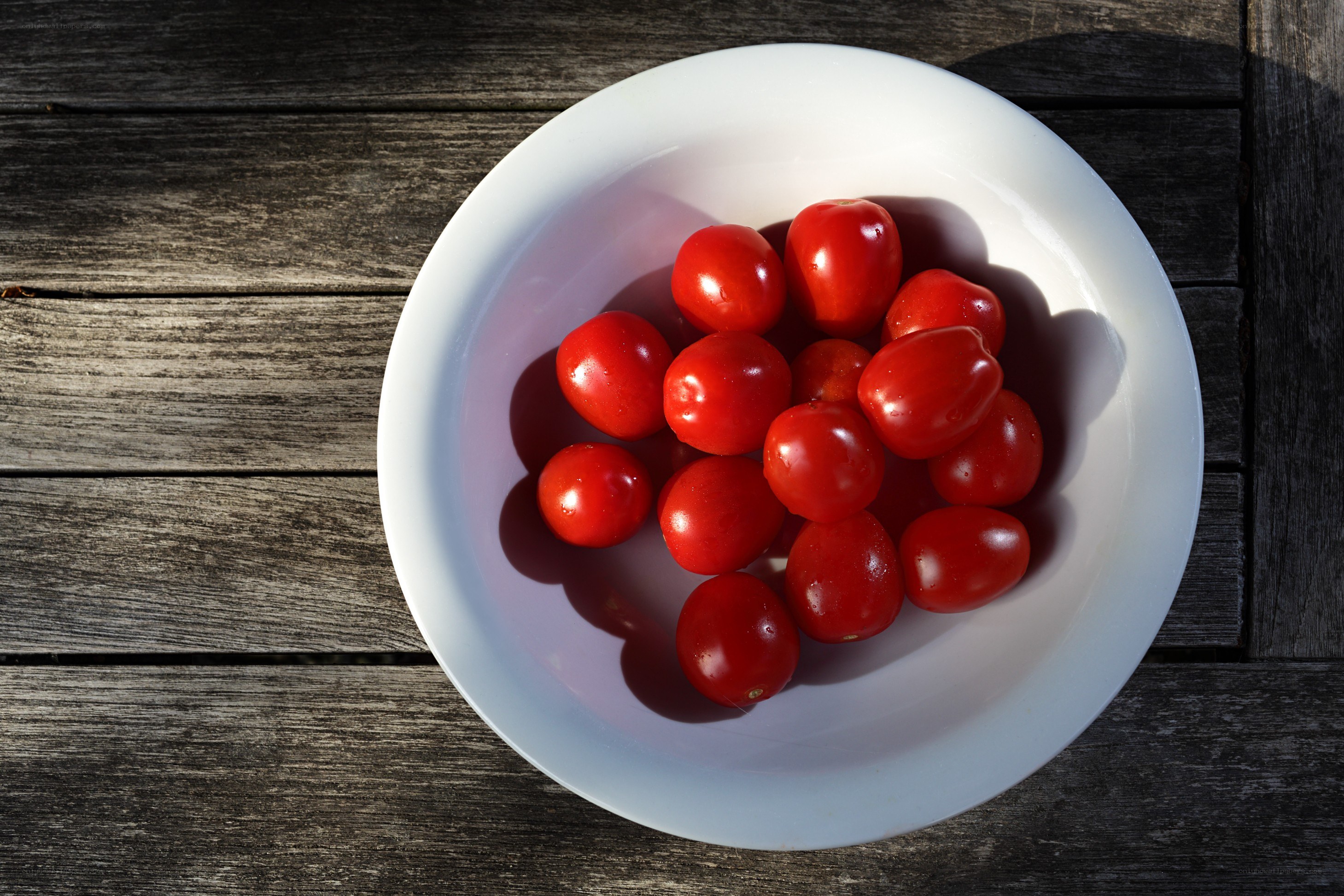 Cherry tomatoes in a white bowl