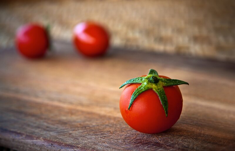 Cherry tomatoes on wood