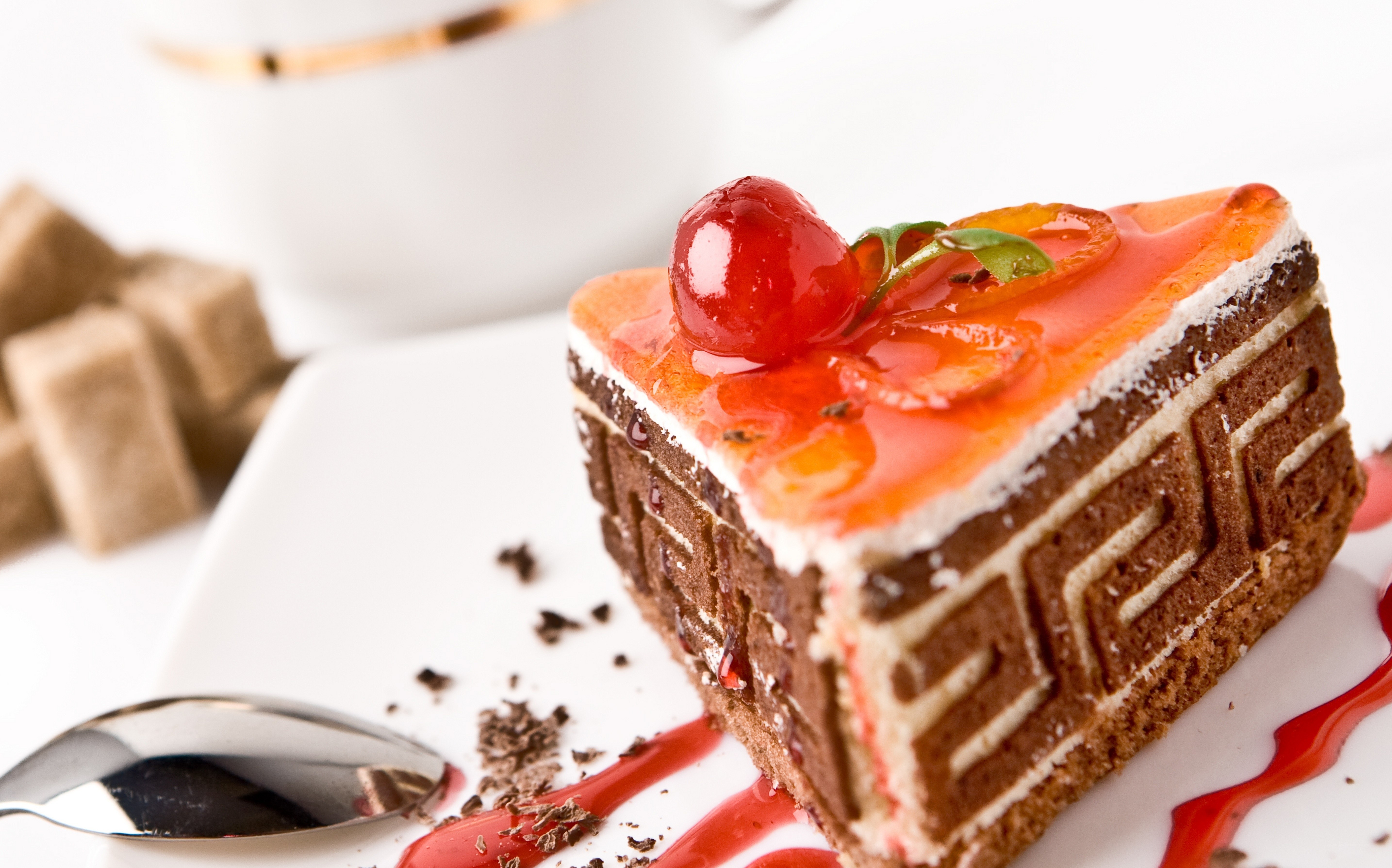 cherry-topped chocolate cake slice