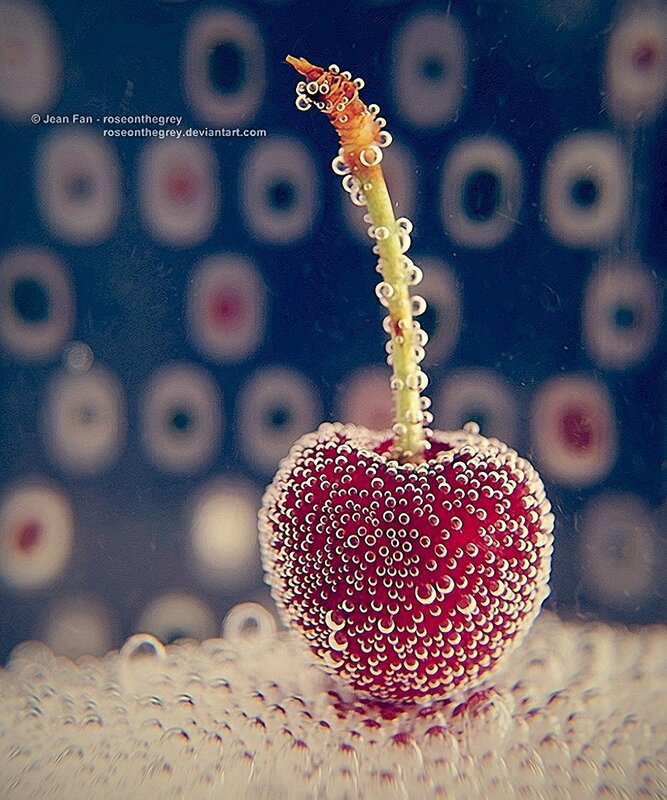 Cherry with bubbles underwater