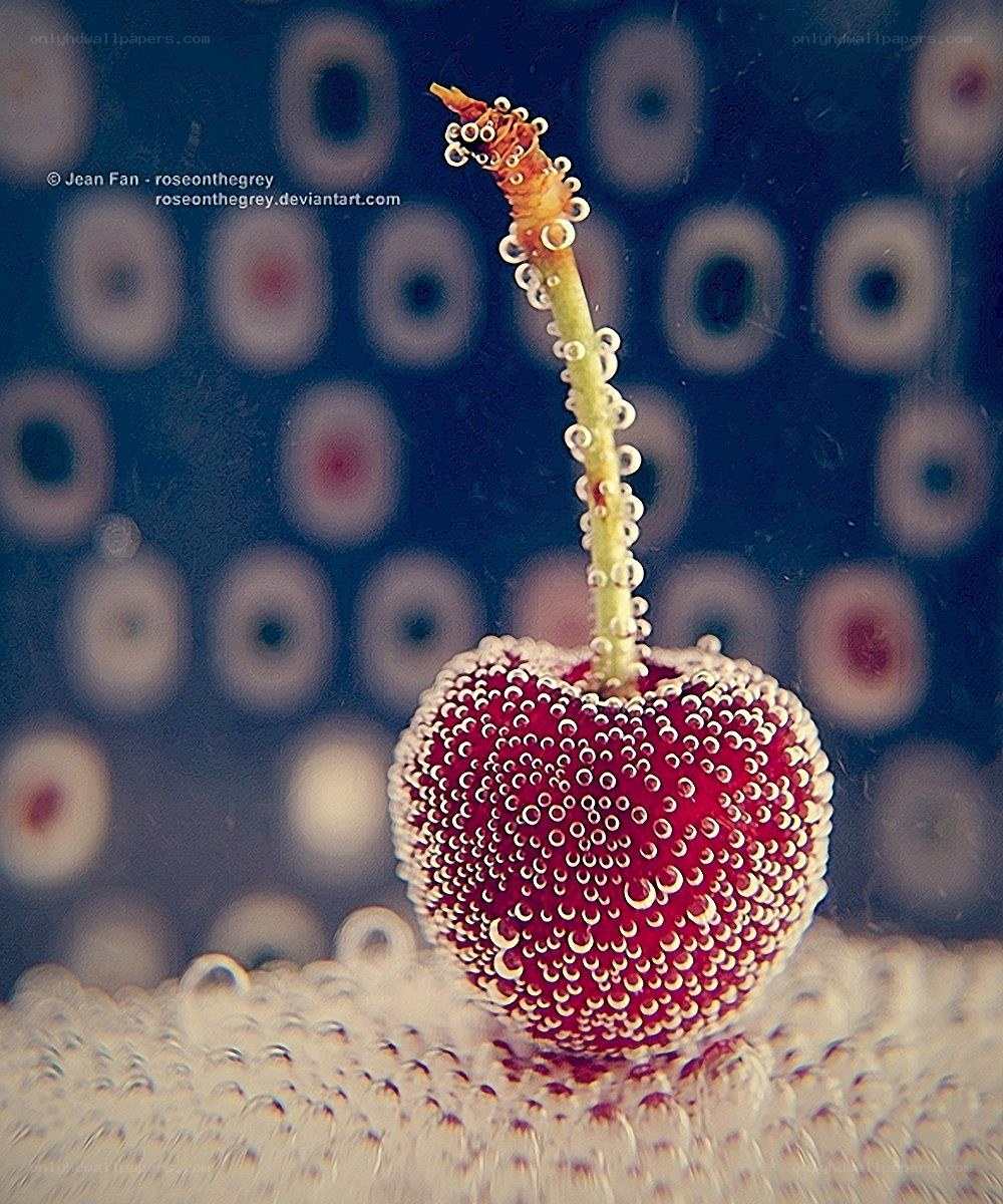 Cherry with bubbles underwater