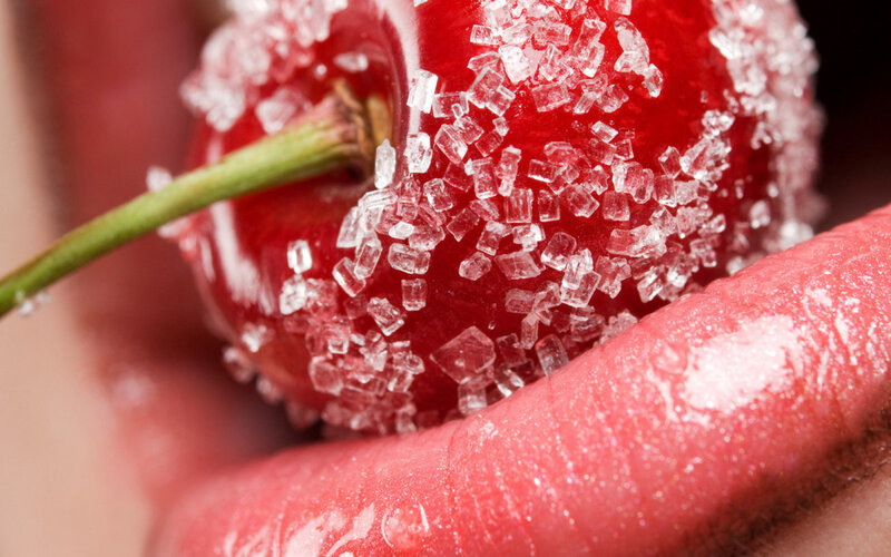cherry with sugar on lips