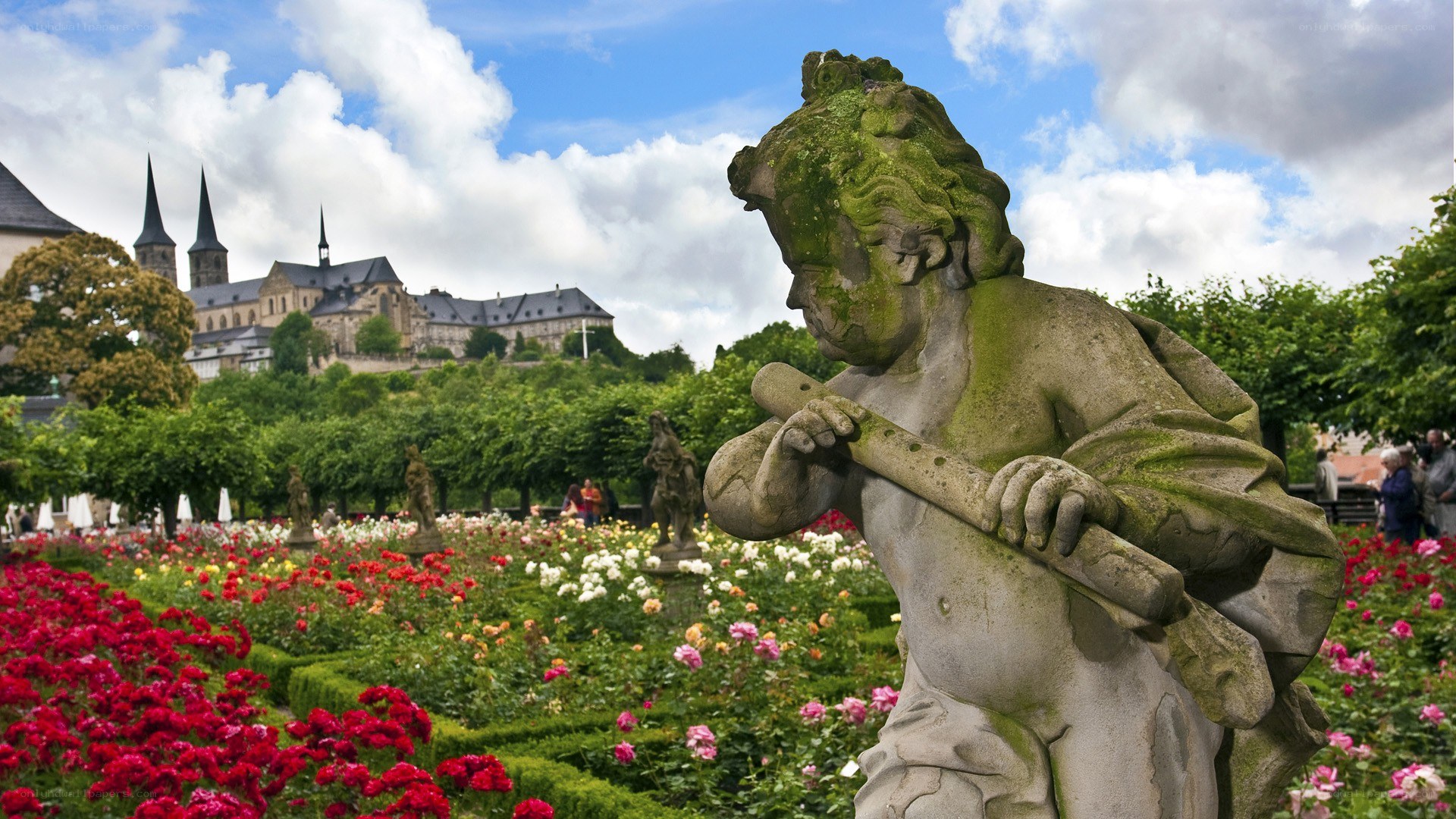 Cherub statue in rose garden