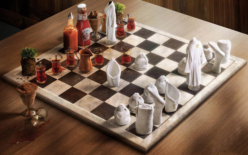 Chess game with food and towels