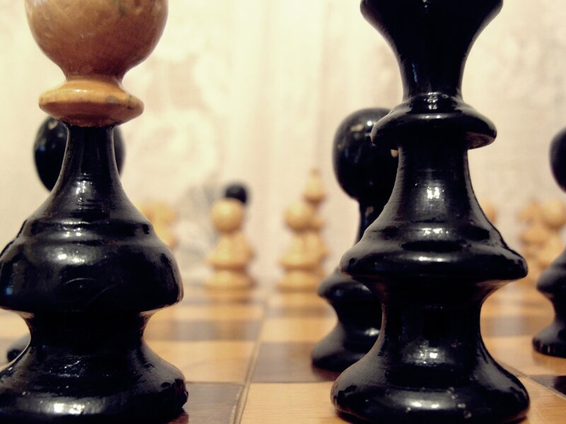 Chess Pieces on Board — Black, Focused