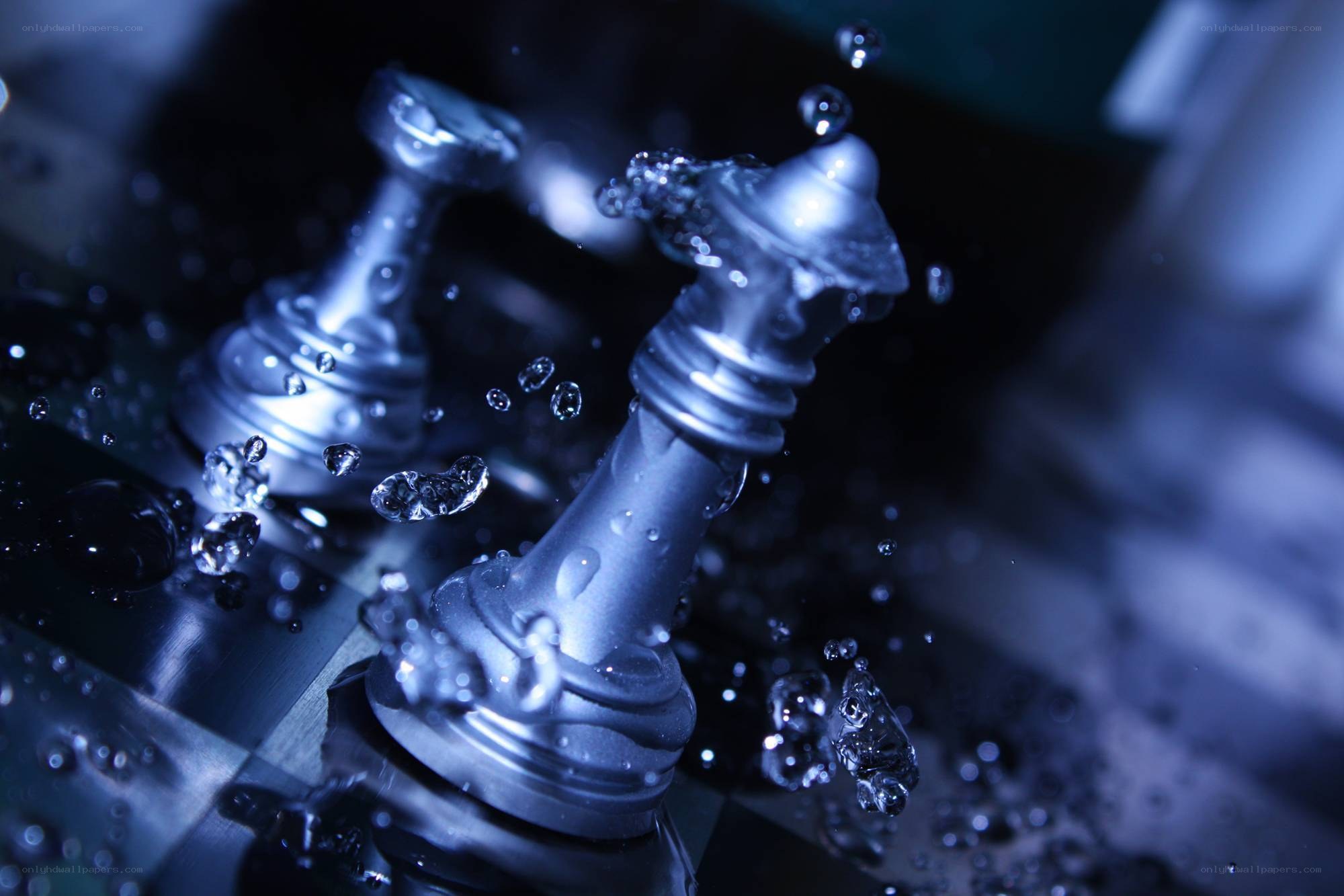 Chess pieces splashing in water