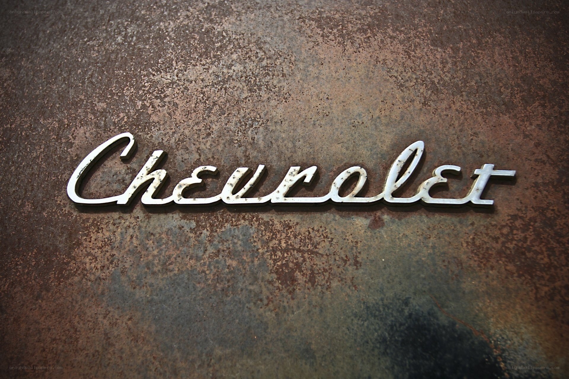 Chevrolet emblem on rusted metal