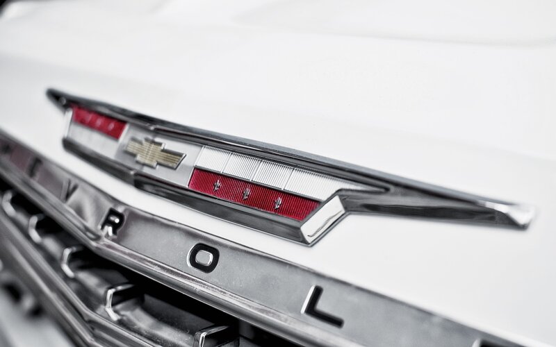 Chevrolet logo on white car