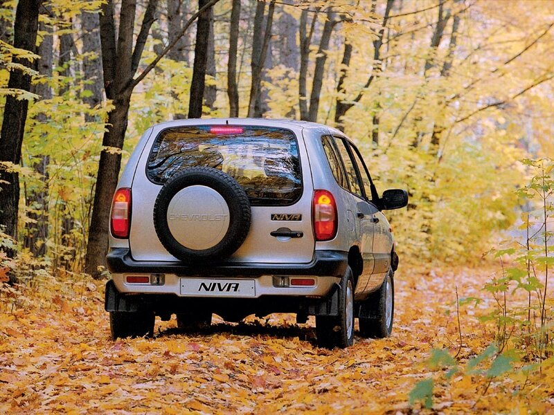 Chevrolet Niva in autumn forest