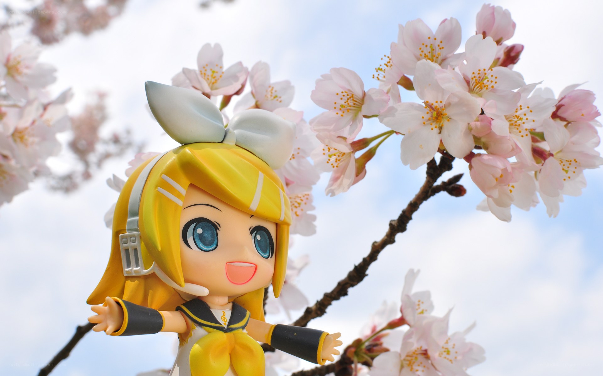 Chibi figure among cherry blossoms
