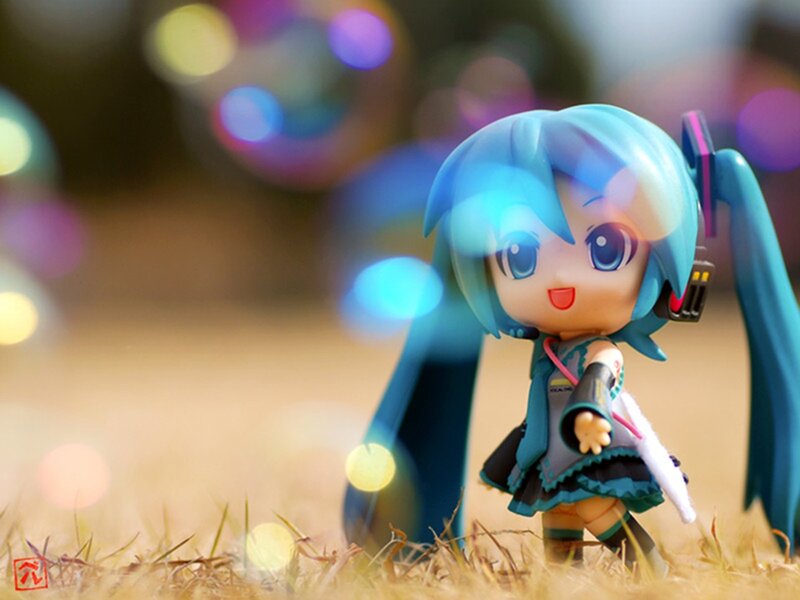 Chibi Figure in Grass — Blue, Playful