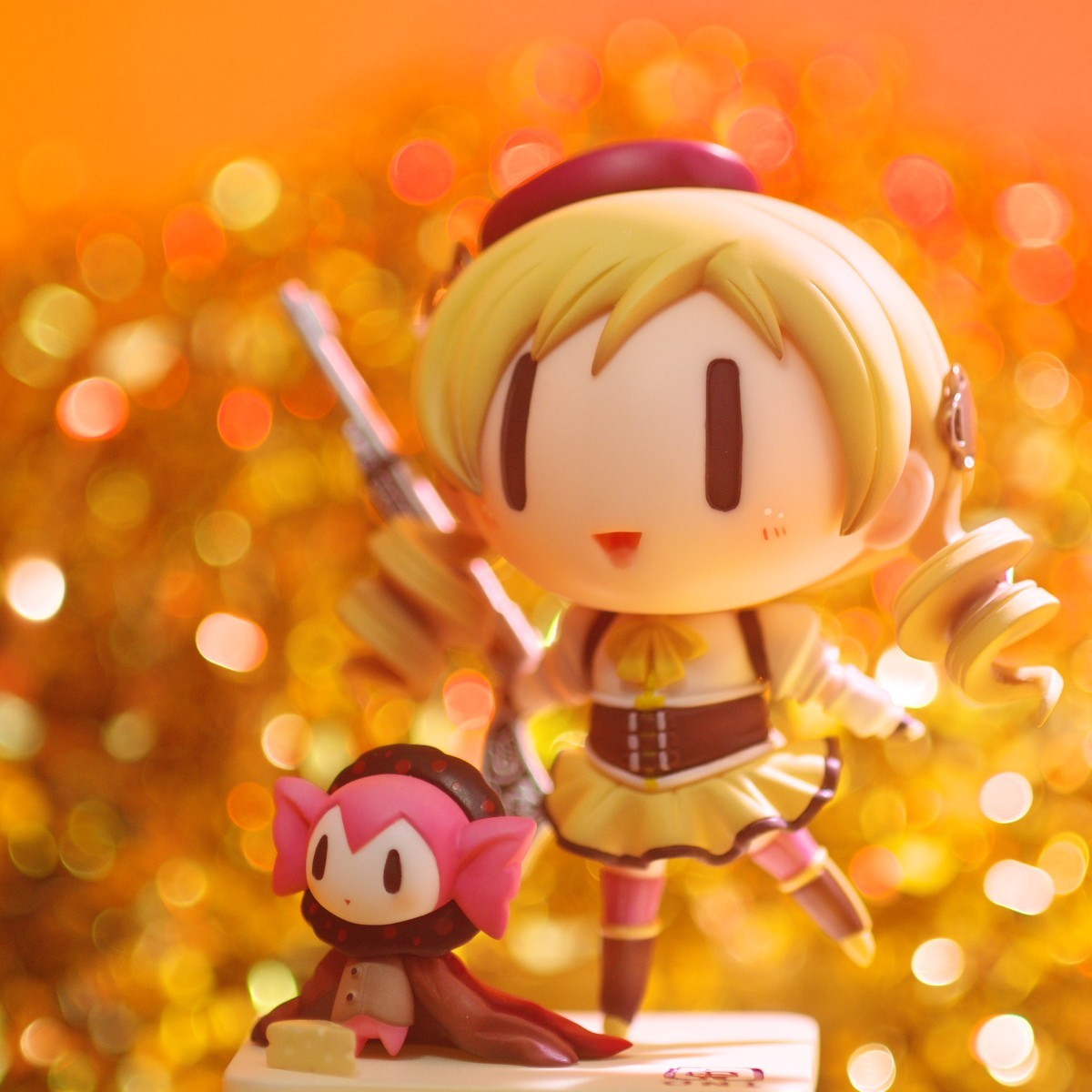 Chibi figures on golden background