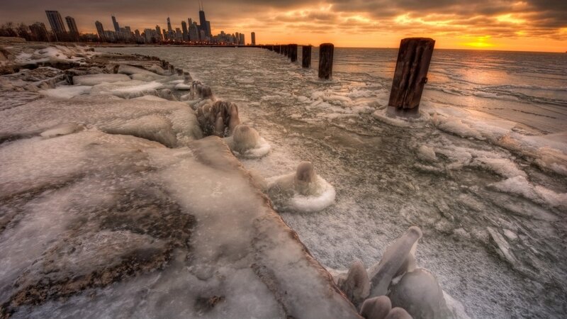 Chicago skyline at sunset on frozen lake