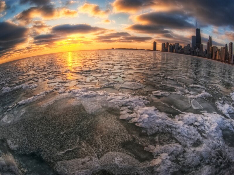 Chicago skyline at sunset on frozen lake