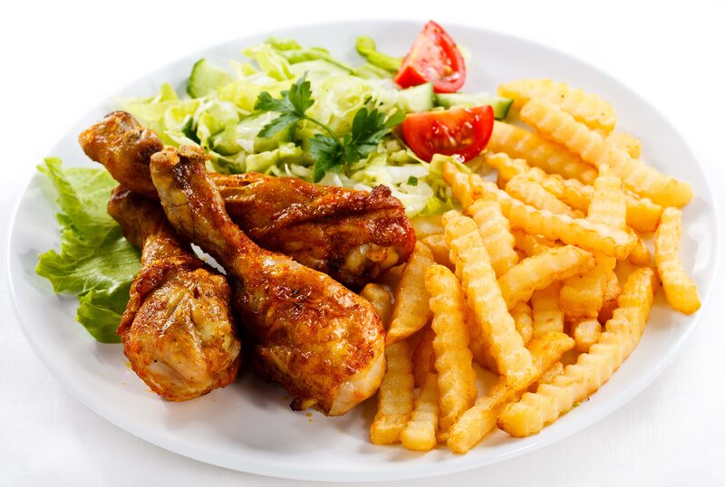 chicken drumsticks with fries and salad