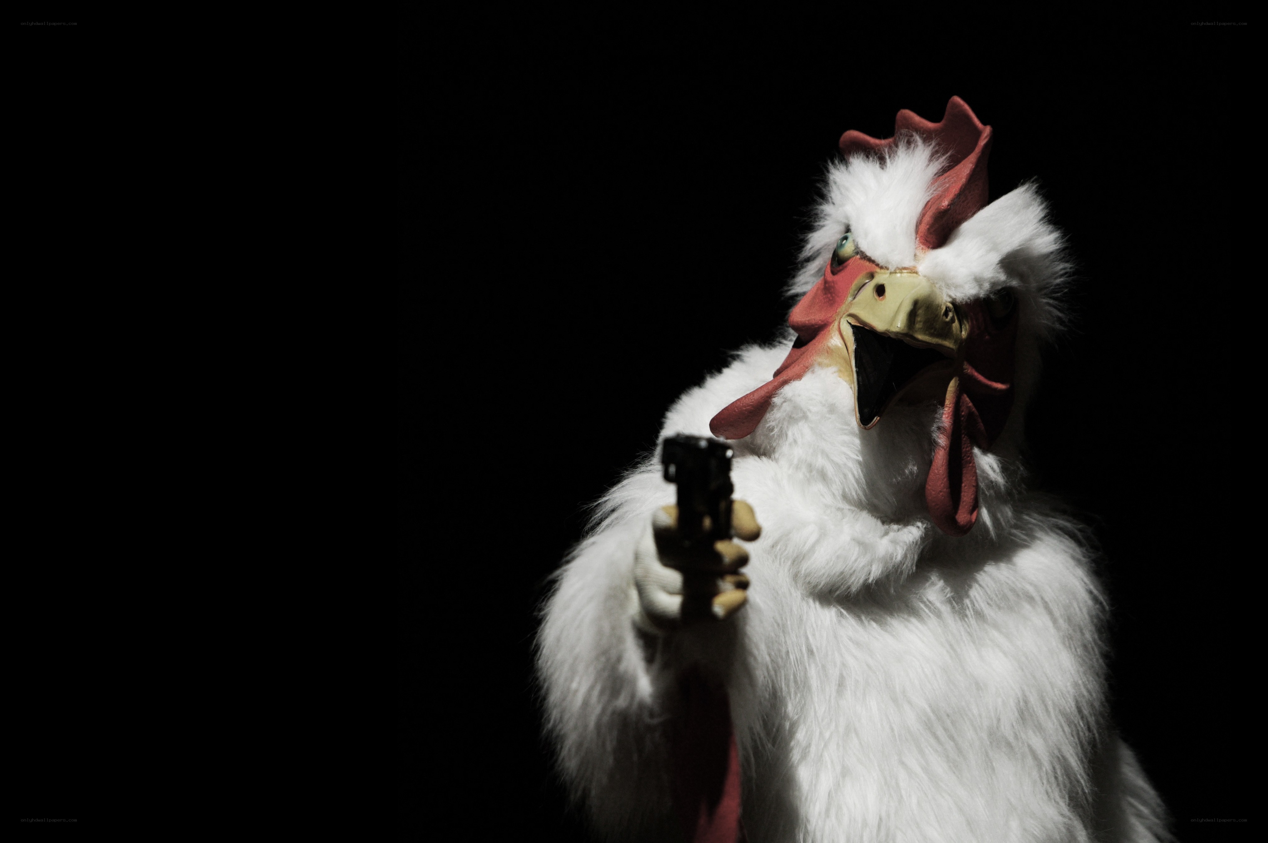 chicken mascot holding gun