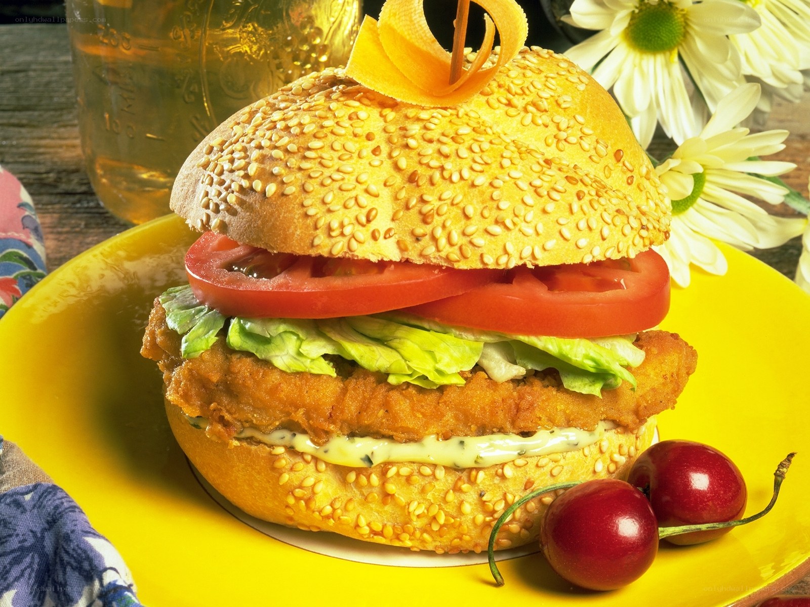 chicken sandwich with cherry garnish