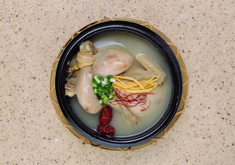 chicken soup in a clay pot