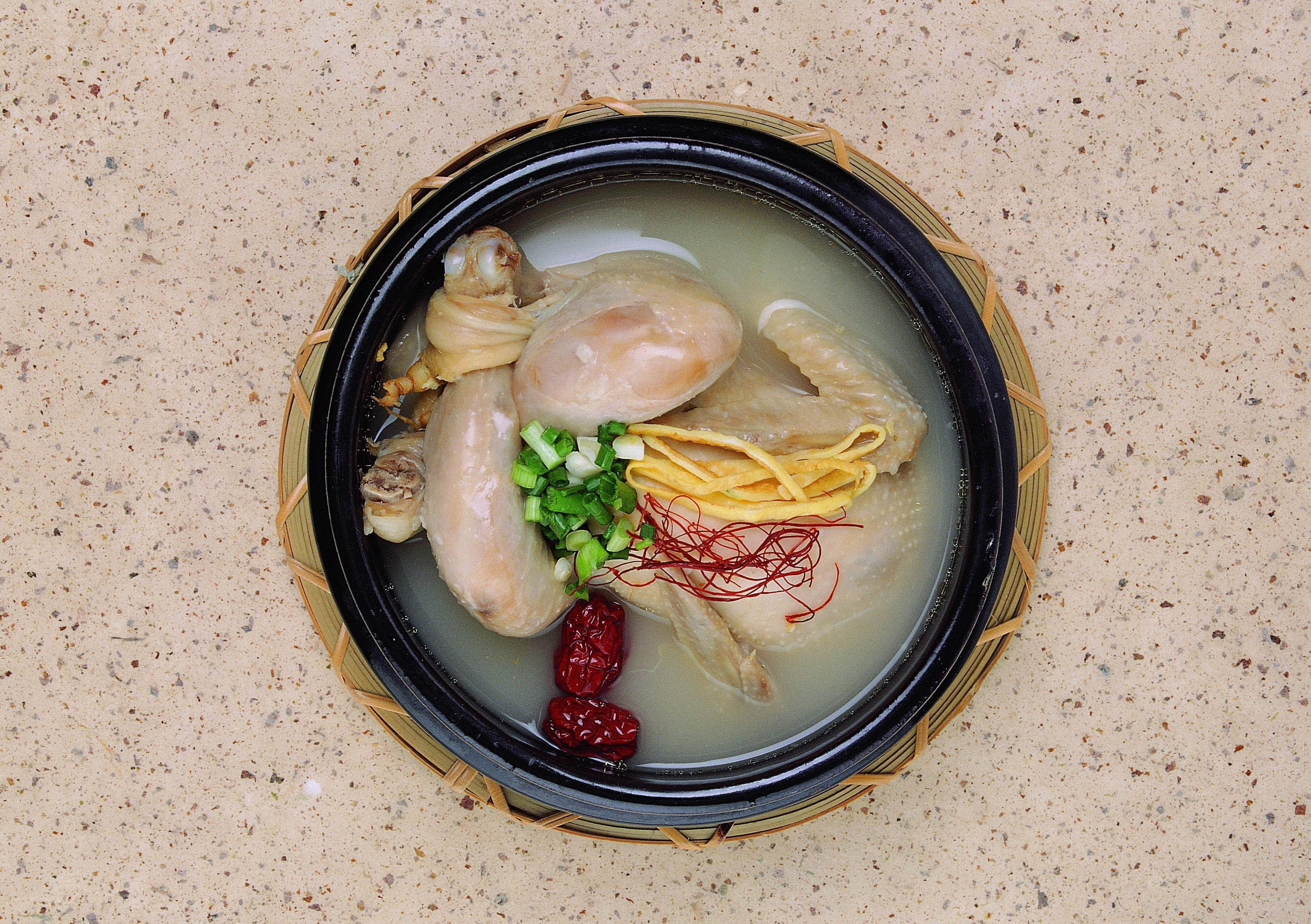 chicken soup in a clay pot