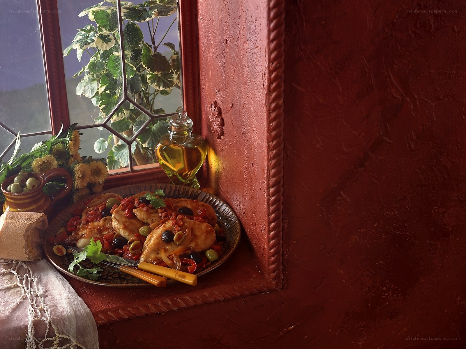 Chicken with olives on window sill