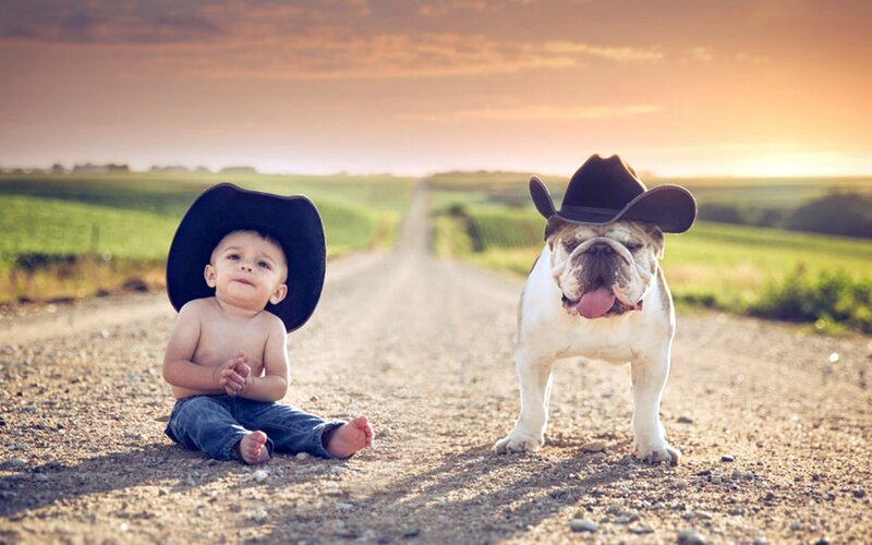 Child and Bulldog on Road — Brown
