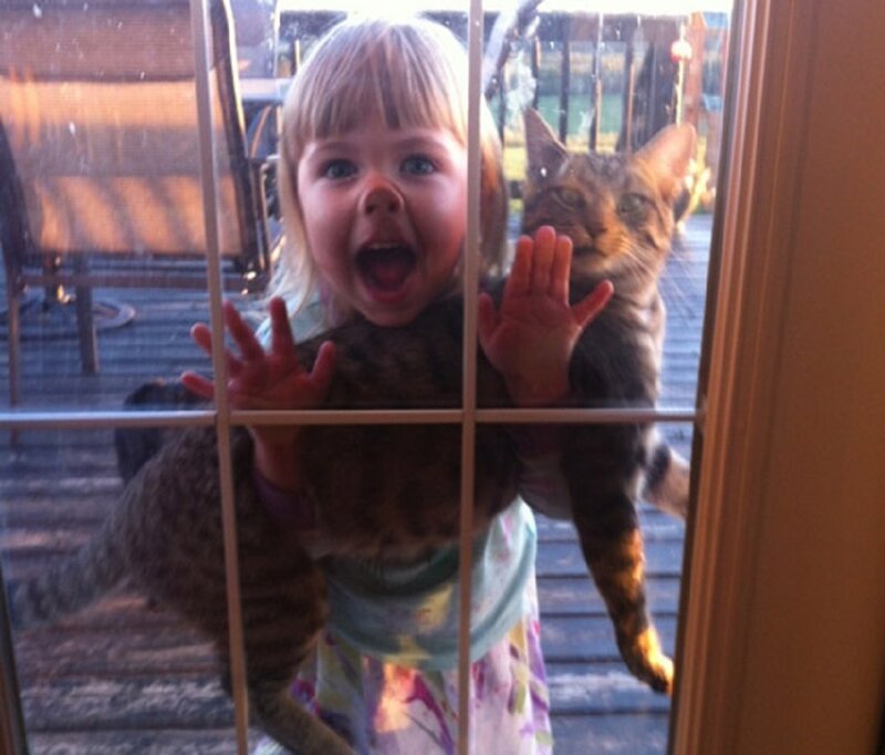 Child and Cat at Door