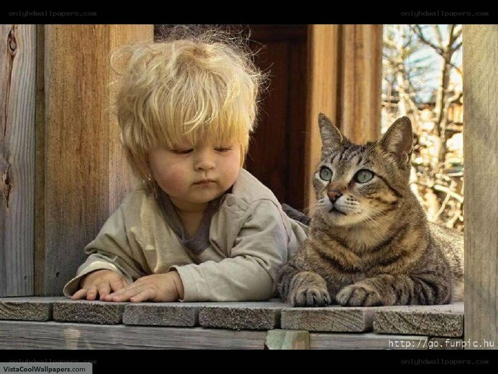 child and cat on porch
