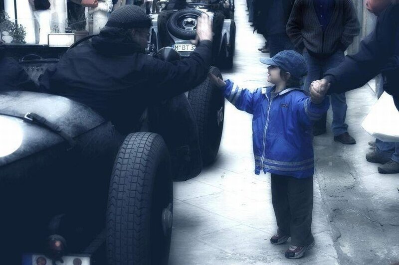 child and man handshaking