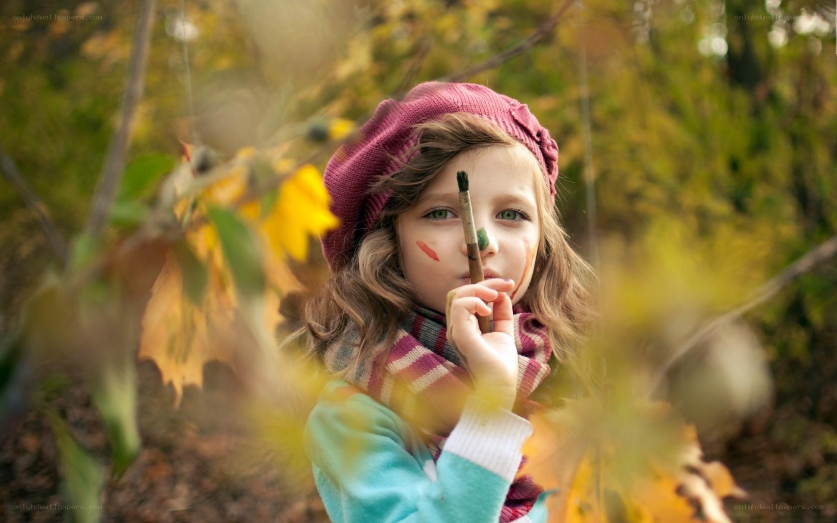 child artist in autumn forest