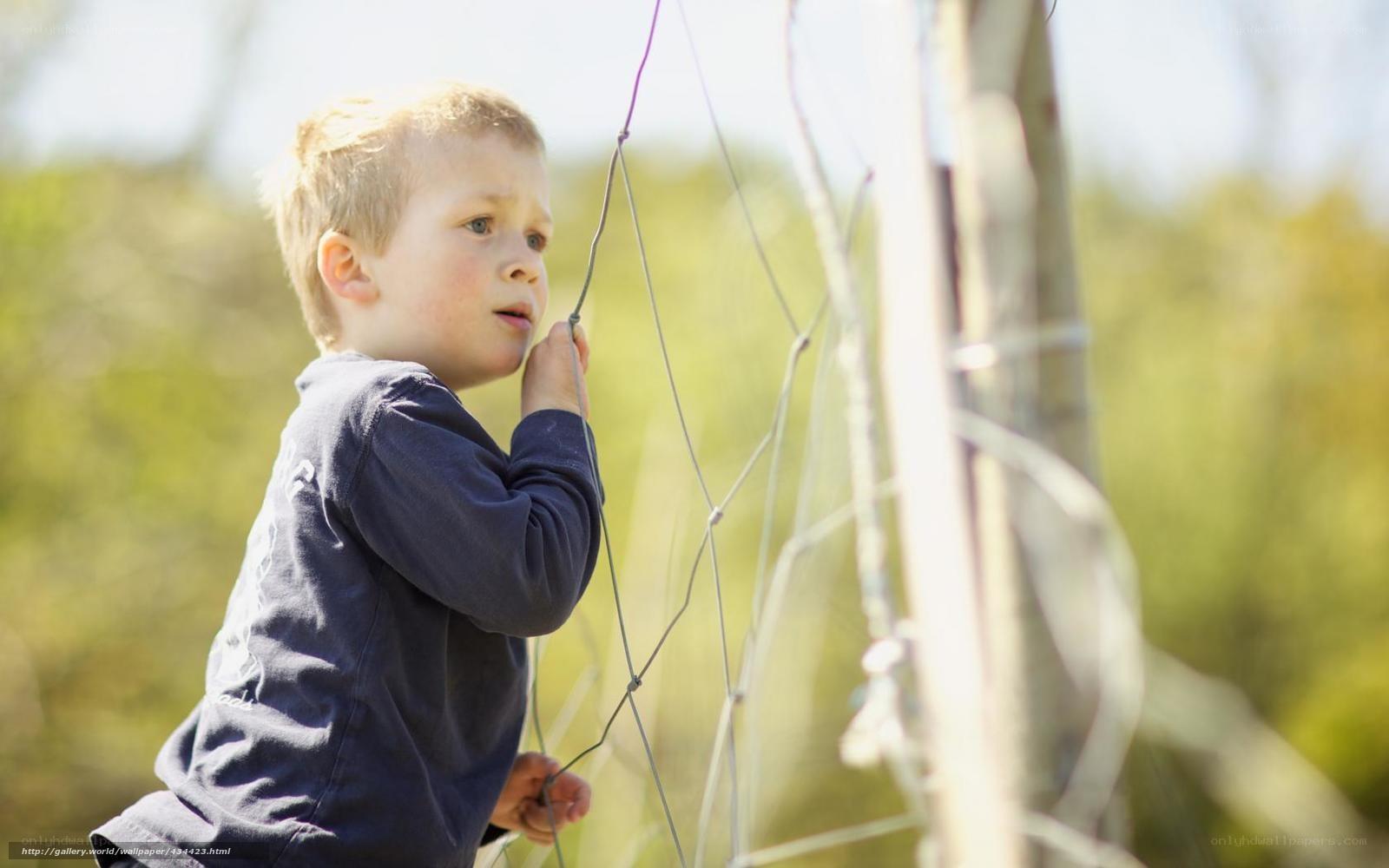 child at a fence