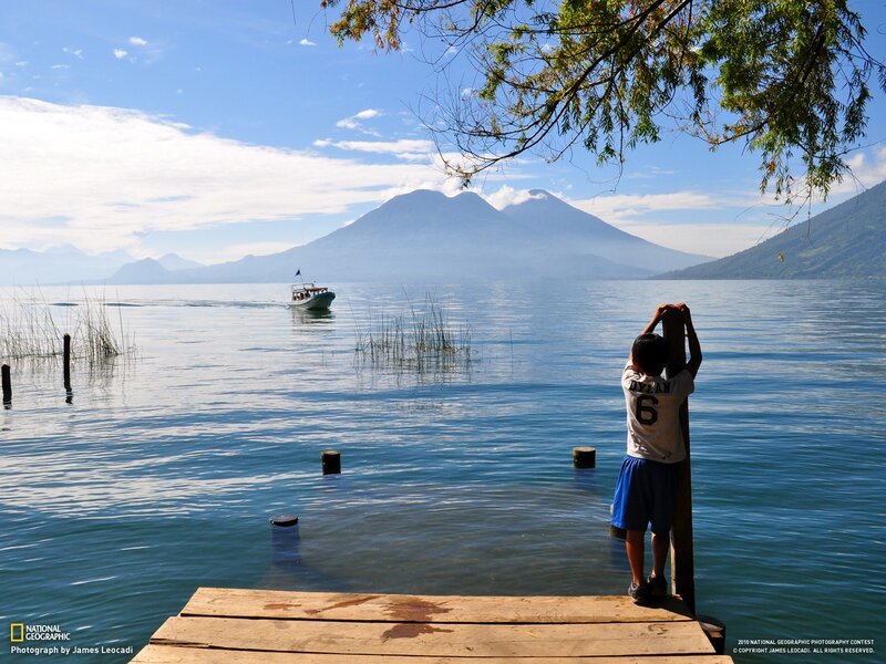 Child at a lakeside dock