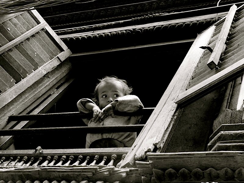 child at a window