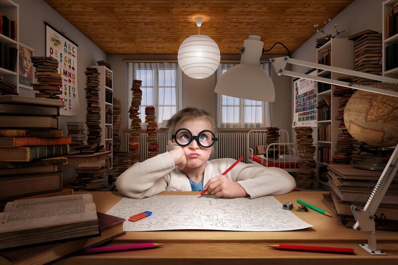 Child at Desk with Books