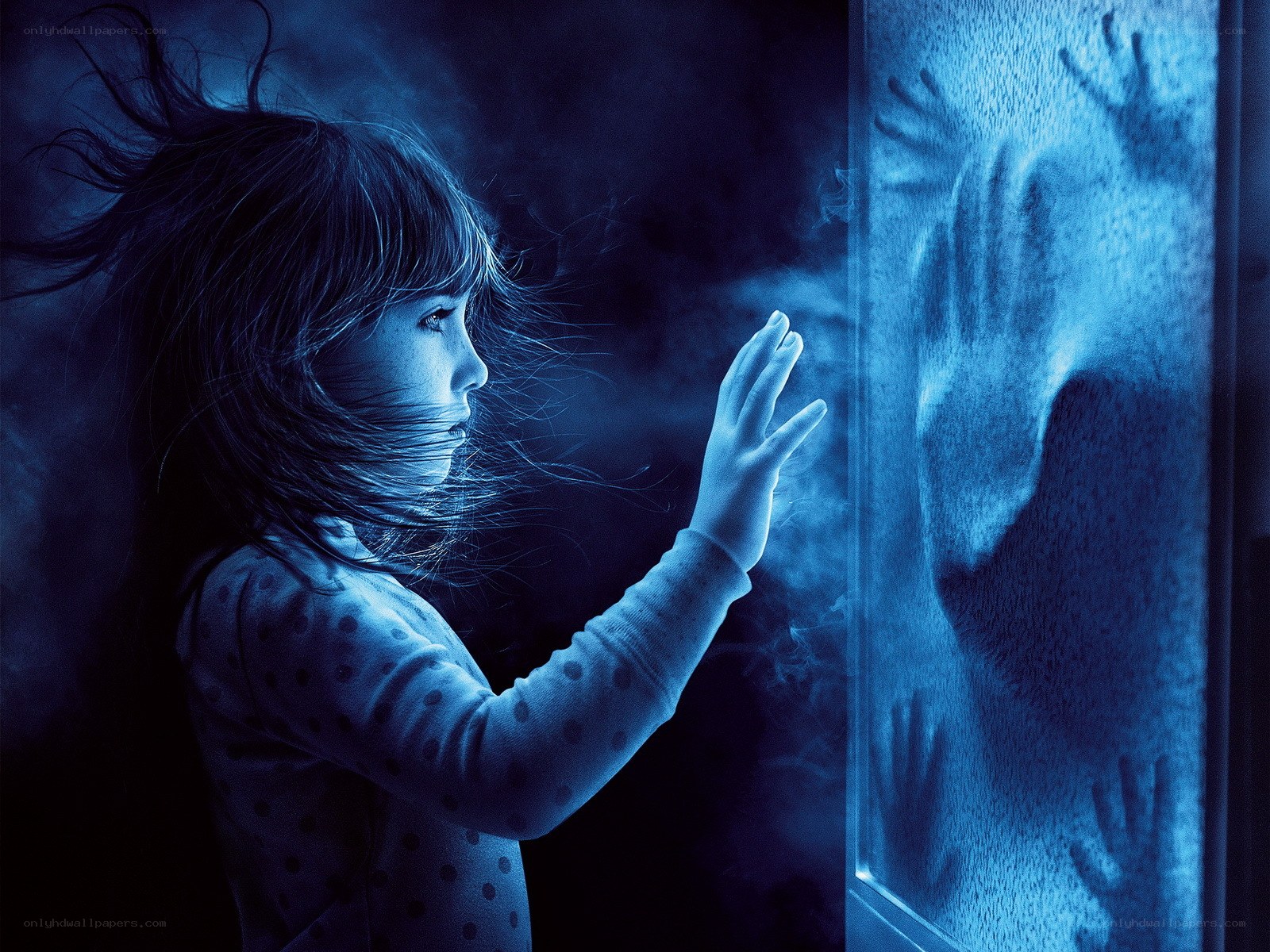 child at foggy window