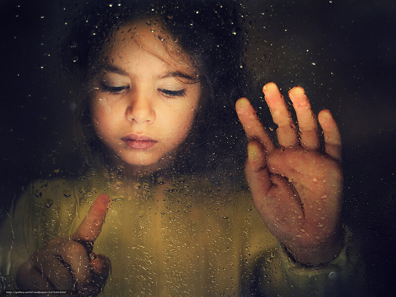 child at rainy window