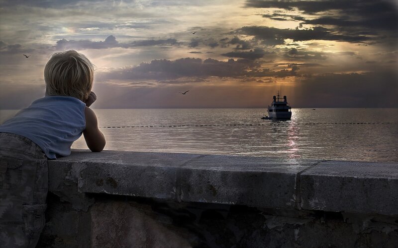 Child at Seaside Wall