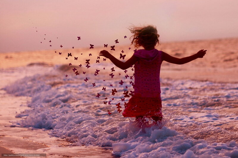 child at sunset on beach