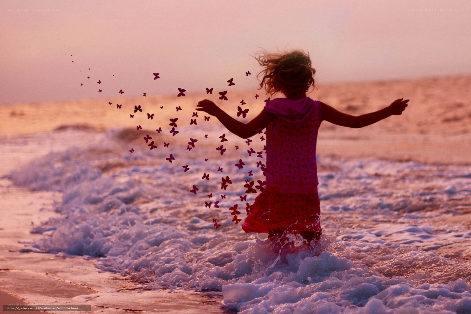 child at sunset on beach