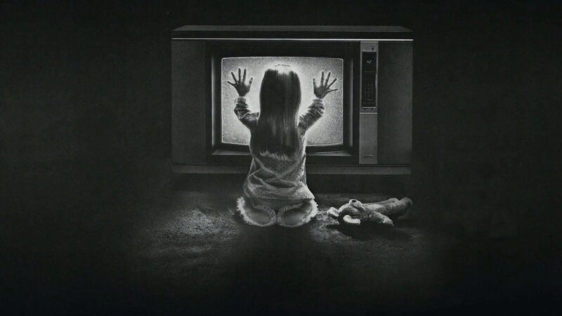 child at television screen