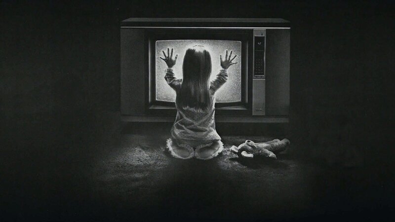 child at television screen